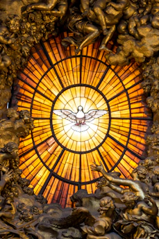 A serene stained glass window depicting a peaceful dove descending, bathed in warm sunlight.