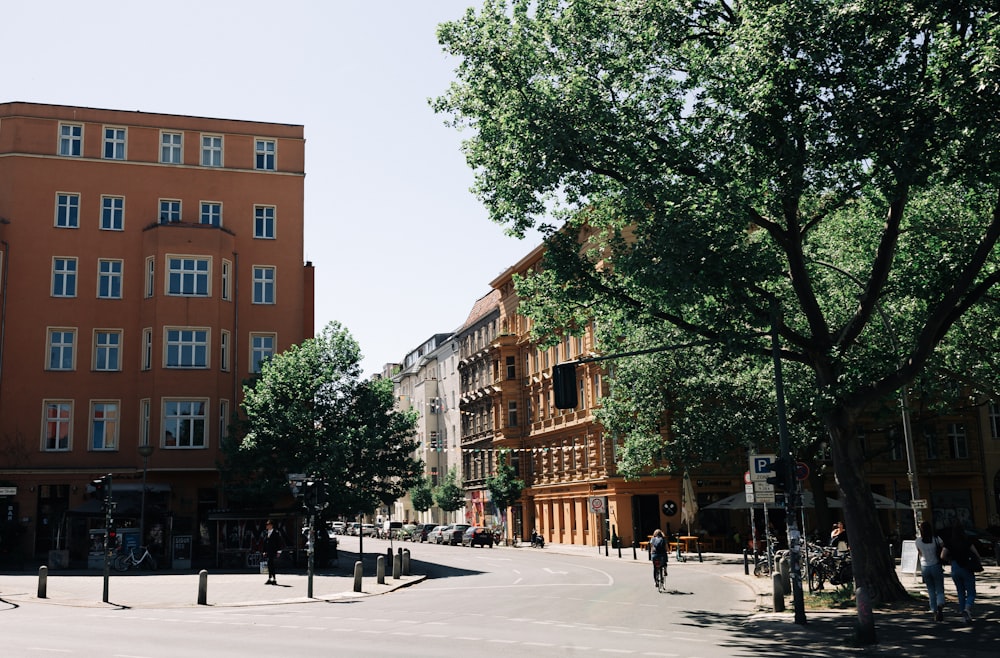 a city street with tall buildings and trees