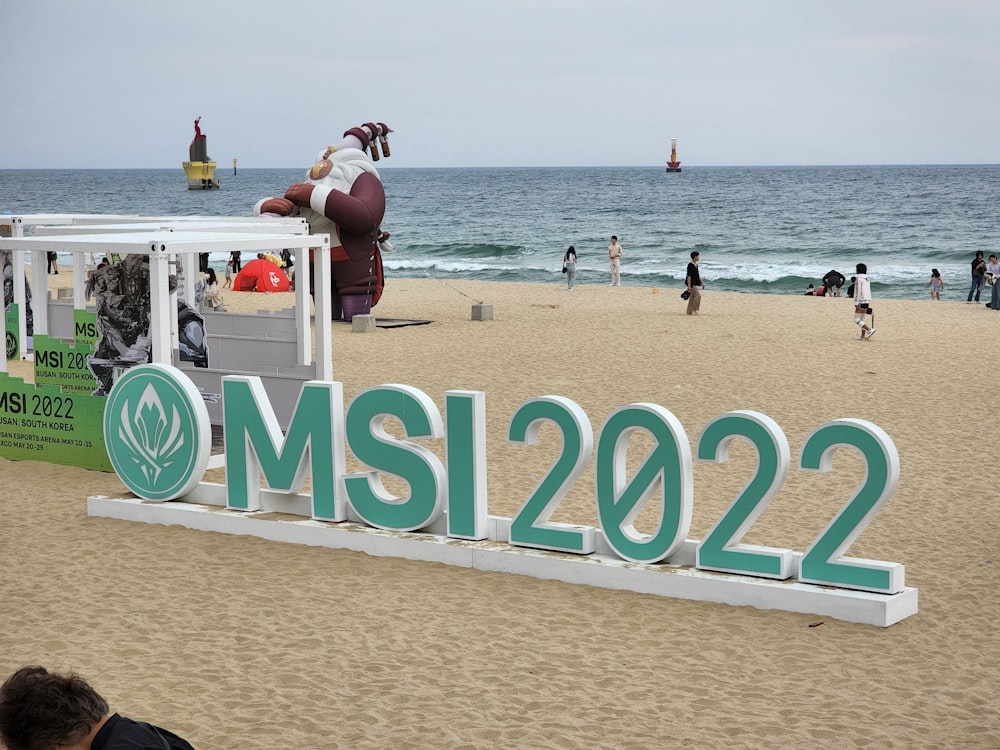 a large sign on the beach that says mssi20222