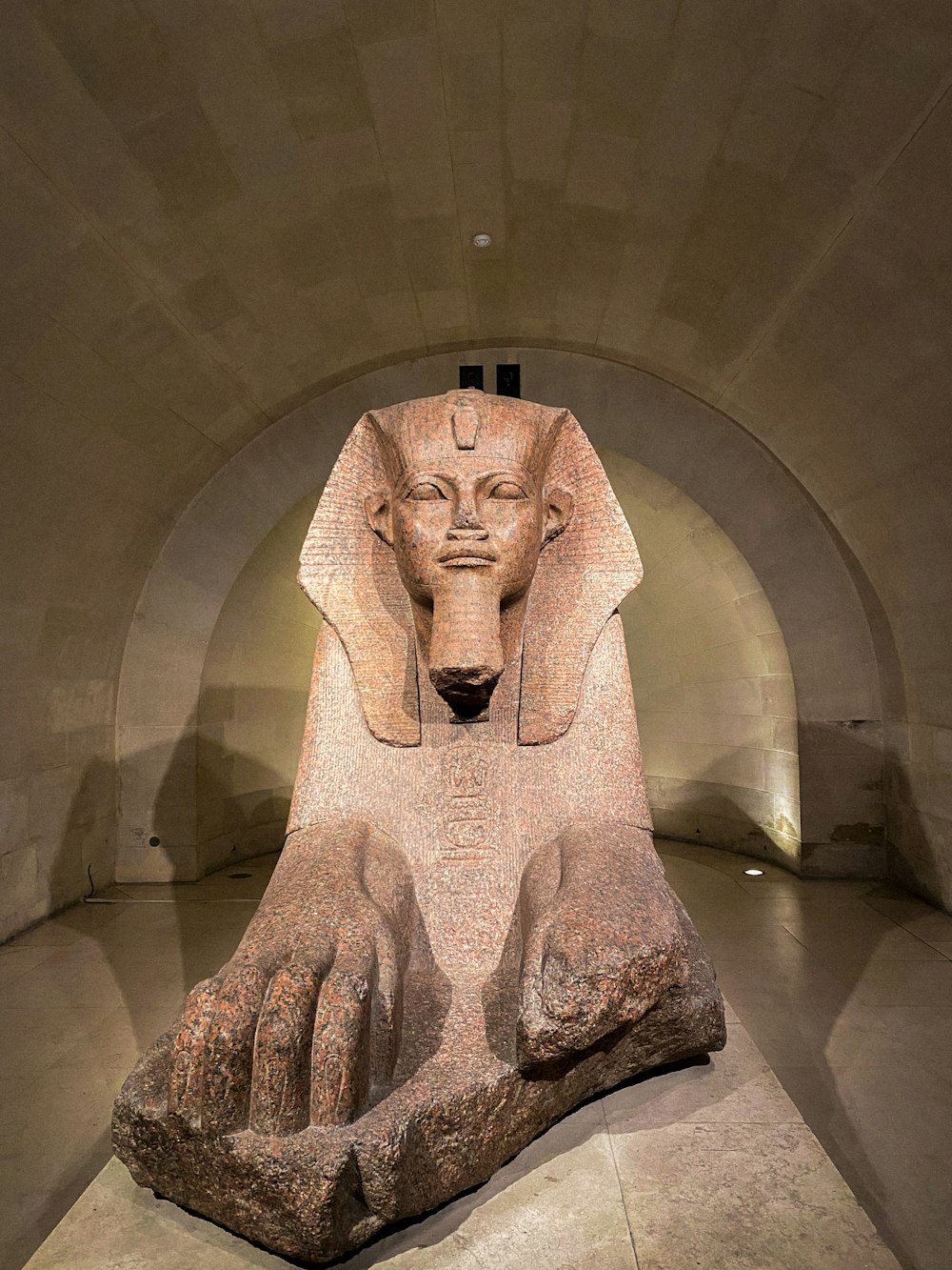 a statue of an egyptian sphinx in a tunnel