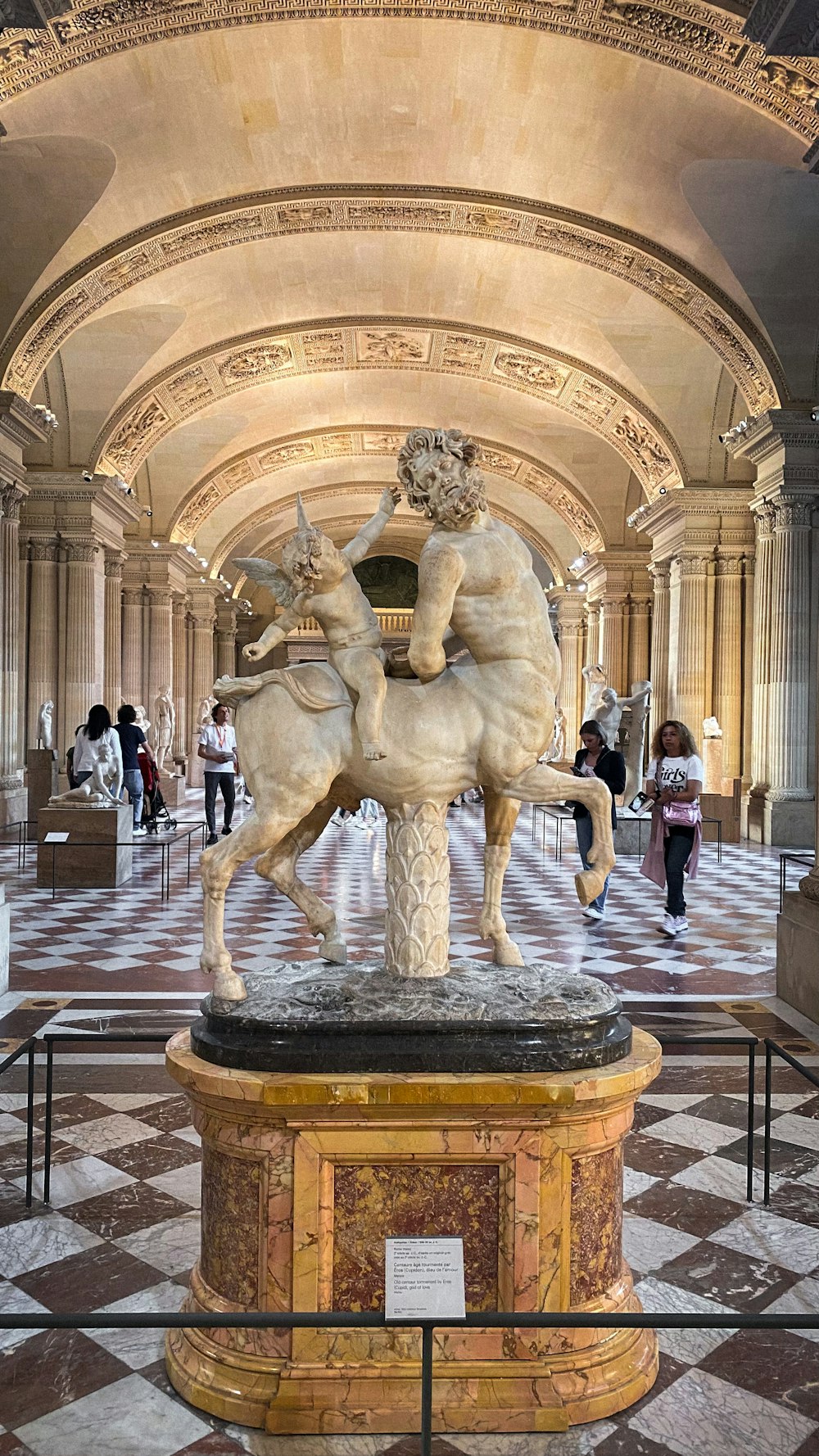 a statue of a man on a horse in a building