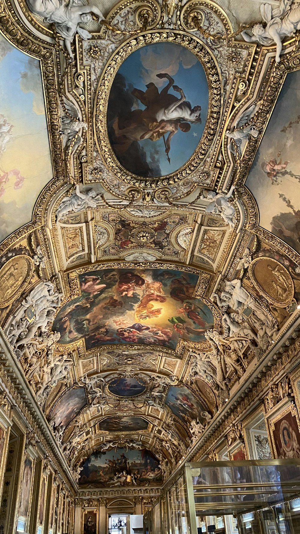 the ceiling of a building with paintings on it