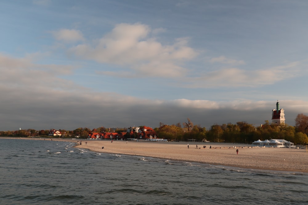a view of a beach with a church in the background