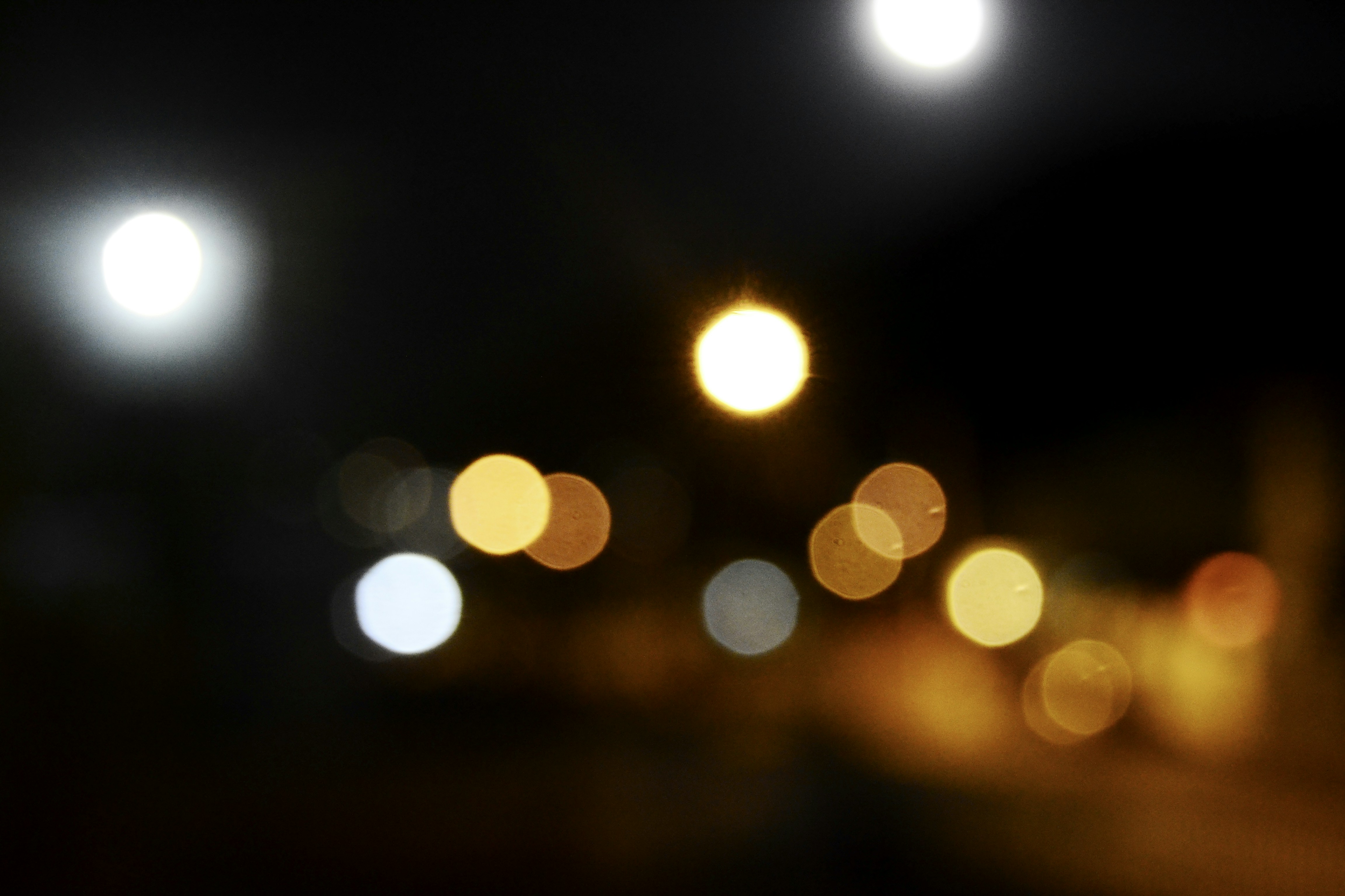 a blurry photo of a street at night