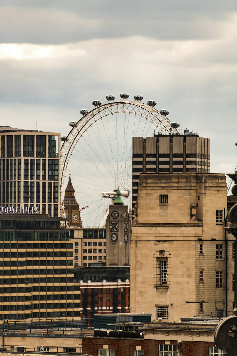 a large ferris wheel in the middle of a city