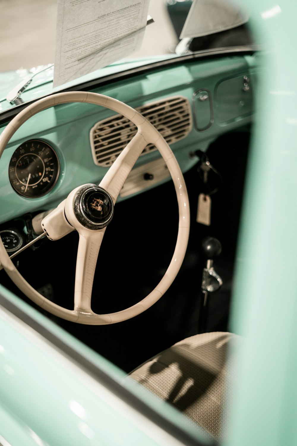 the interior of a car with a steering wheel and dashboard