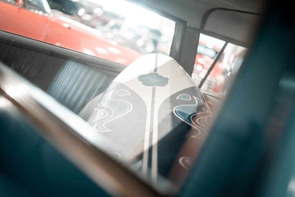 a close up of a surfboard in a vehicle