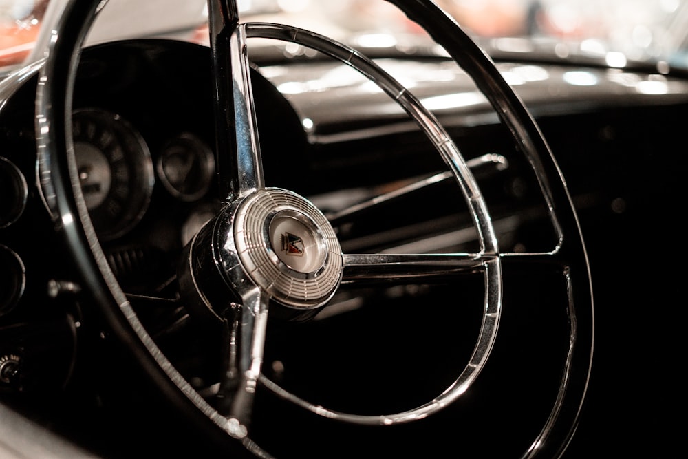 a close up of a steering wheel on a car