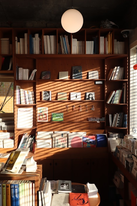 A sleek metal magazine rack beside a comfortable reading nook filled with natural light.