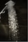 a close up of a shower head with water coming out of it