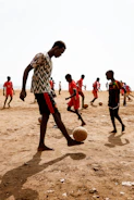 a group of young men playing a game of soccer