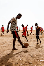 a group of young men playing a game of soccer