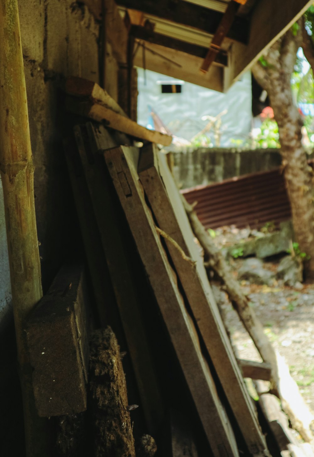 a pile of wood sitting next to a building