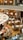 A bustling café scene with happy customers enjoying their meals.