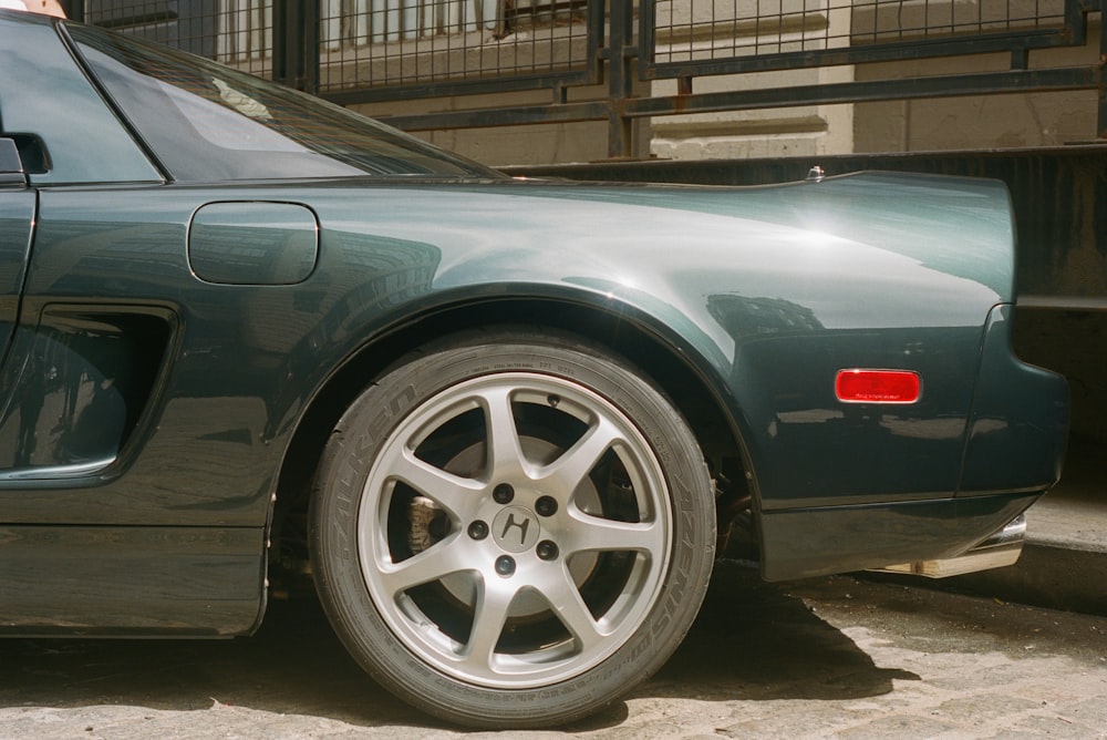 a close up of a car parked on a street