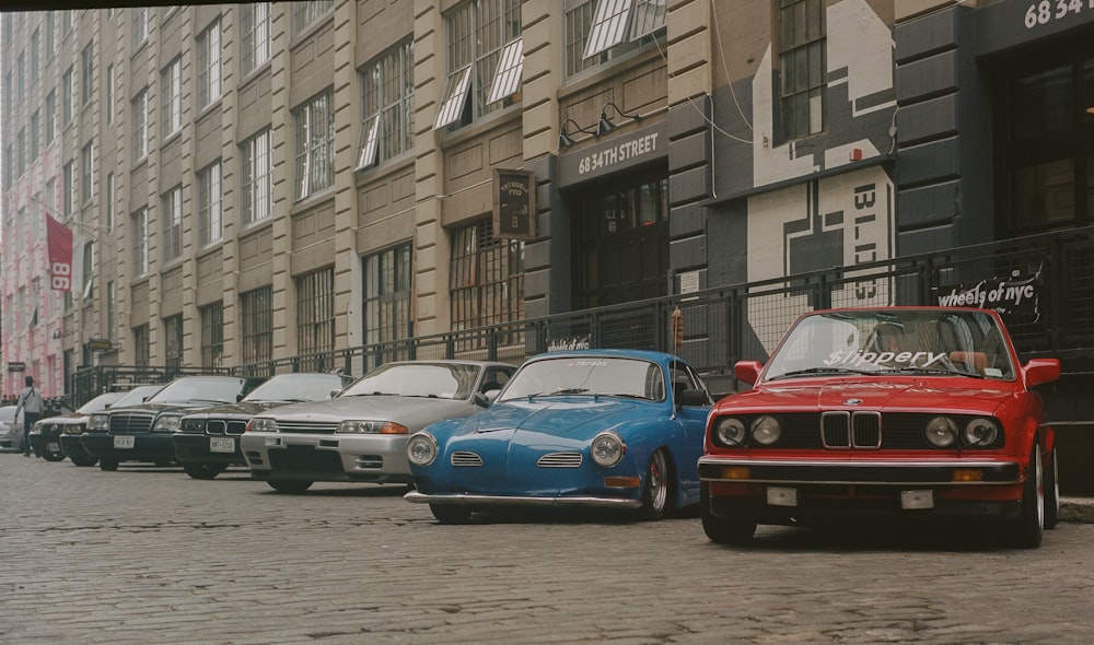 a row of cars parked next to each other on a street