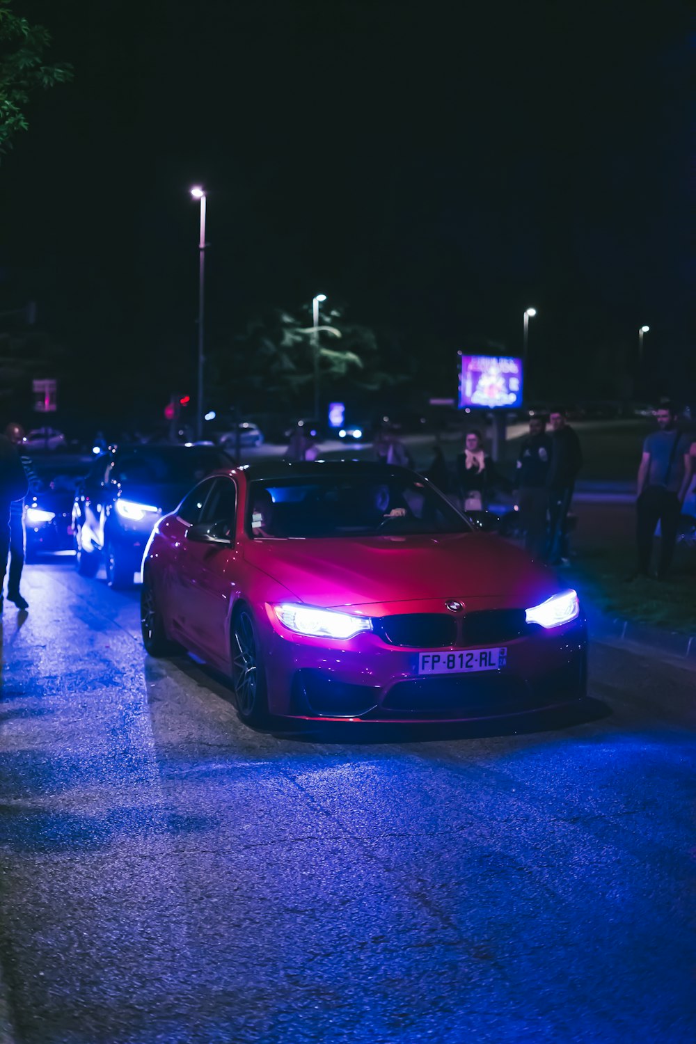 a couple of cars parked on the side of a road