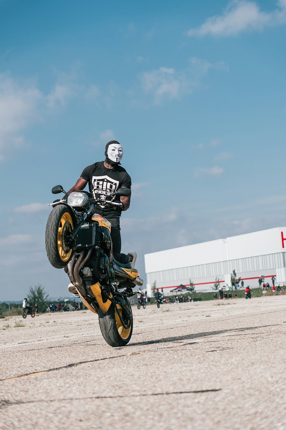 a man riding on the back of a motorcycle