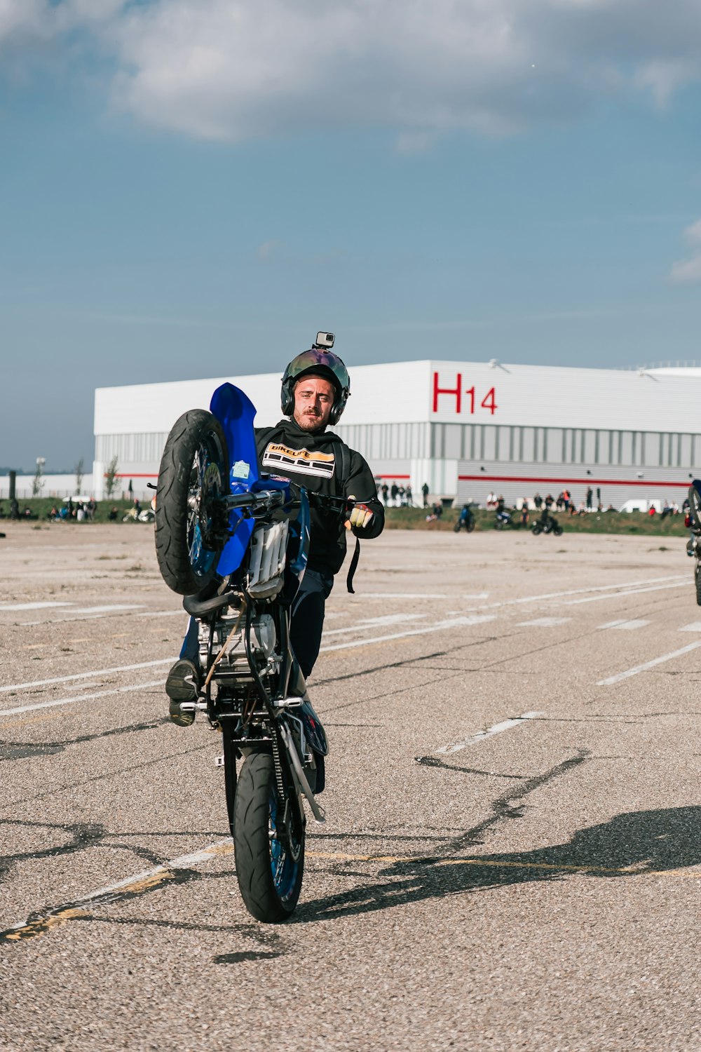 a man riding on the back of a motorcycle