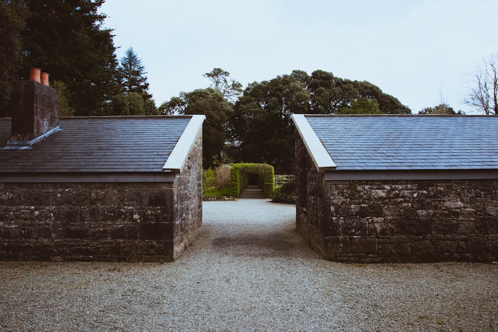 a couple of stone buildings sitting next to each other