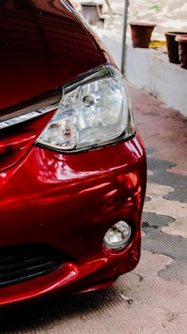 a close up of the front of a red car