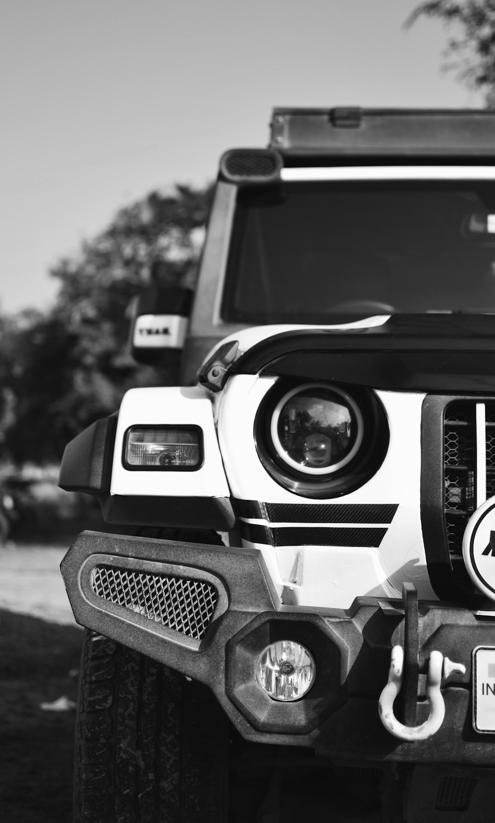 a black and white photo of a jeep