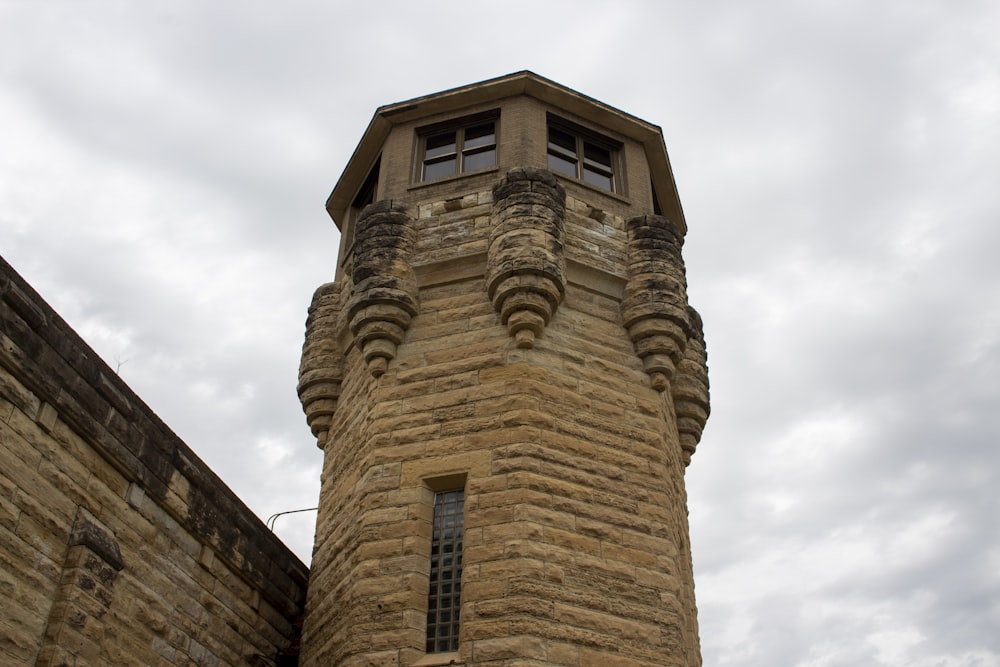 a tall tower with a clock on the top of it