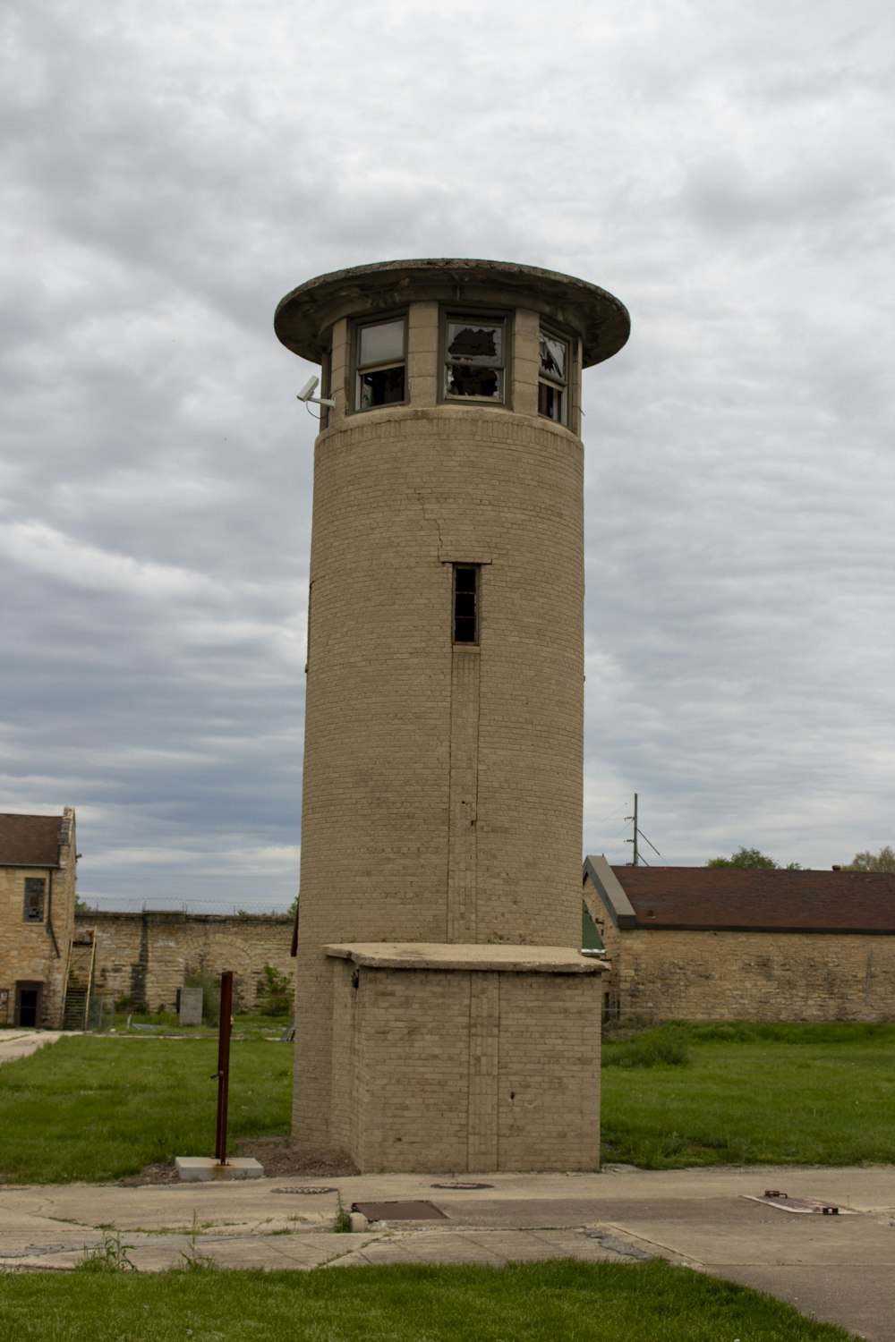 a tall tower sitting in the middle of a field