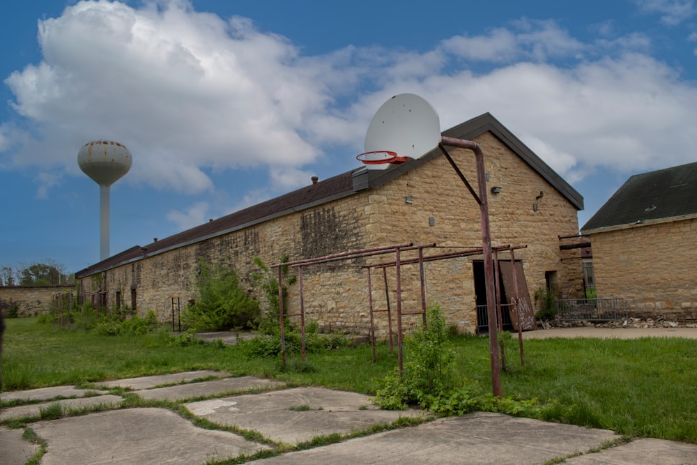 a brick building with a basketball hoop in front of it