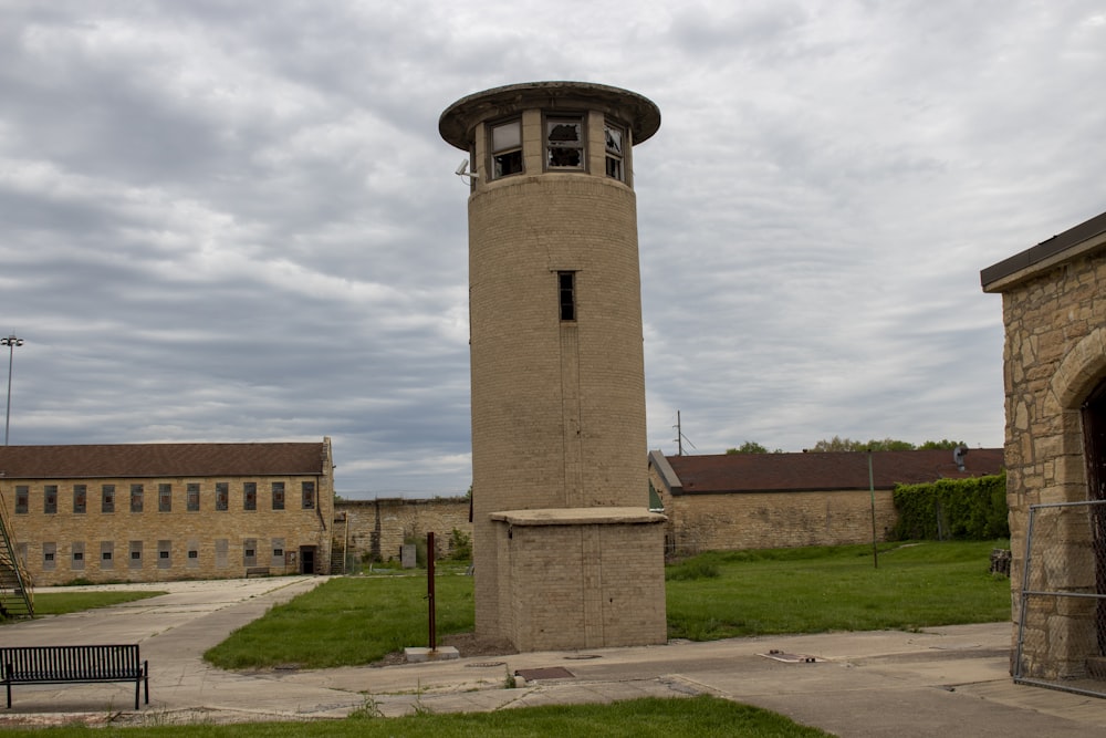 a tall tower sitting in the middle of a field