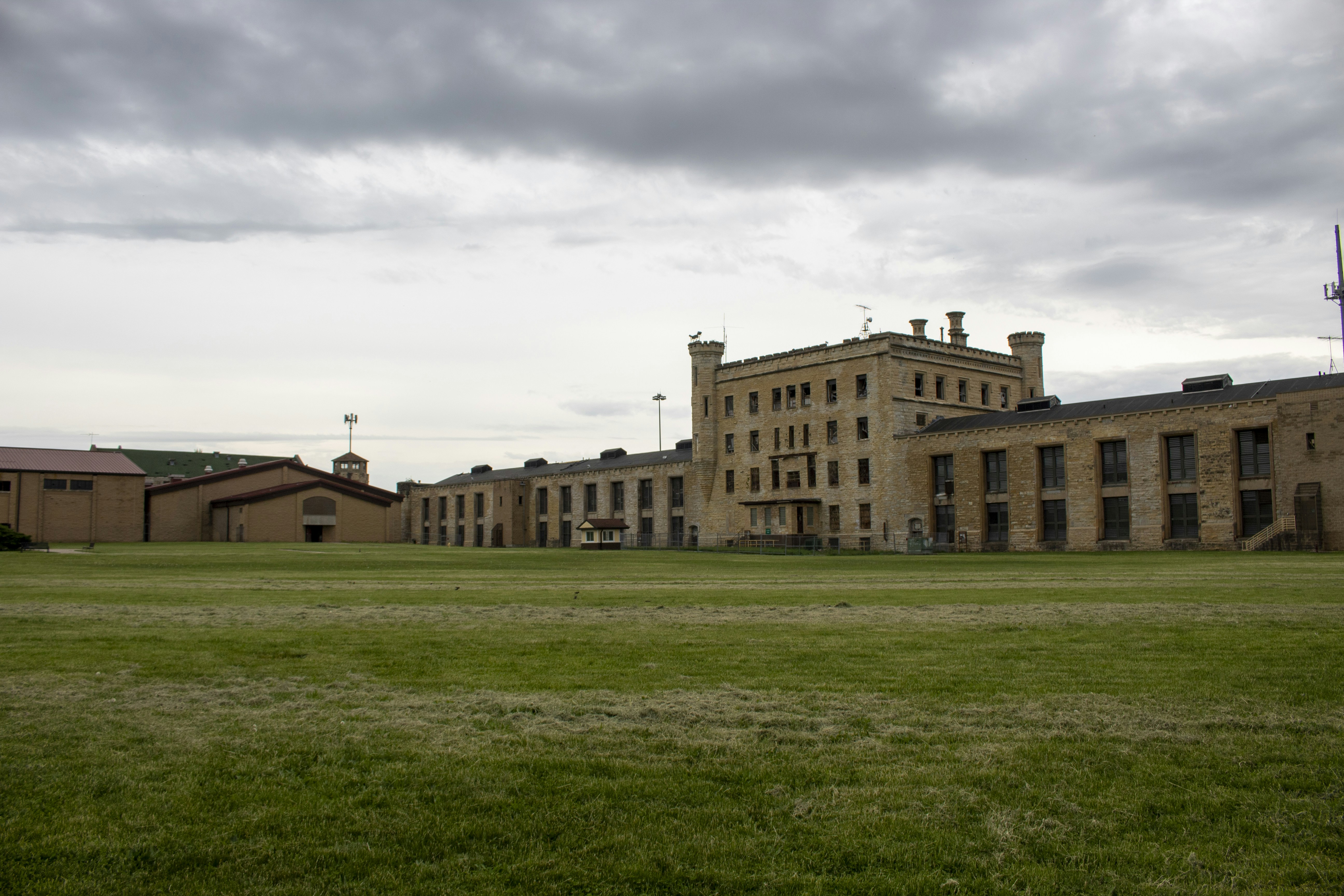 a large building sitting on top of a lush green field