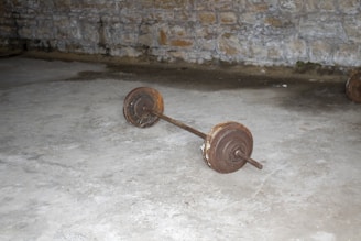 A close-up of rusty gym weights stacked together, showcasing their vintage charm.
