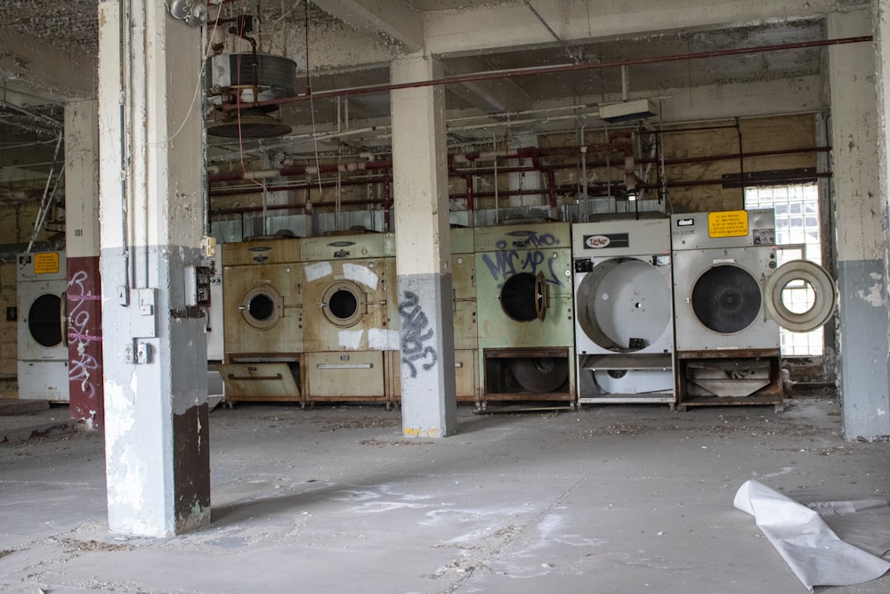 a large room with a bunch of washing machines in it