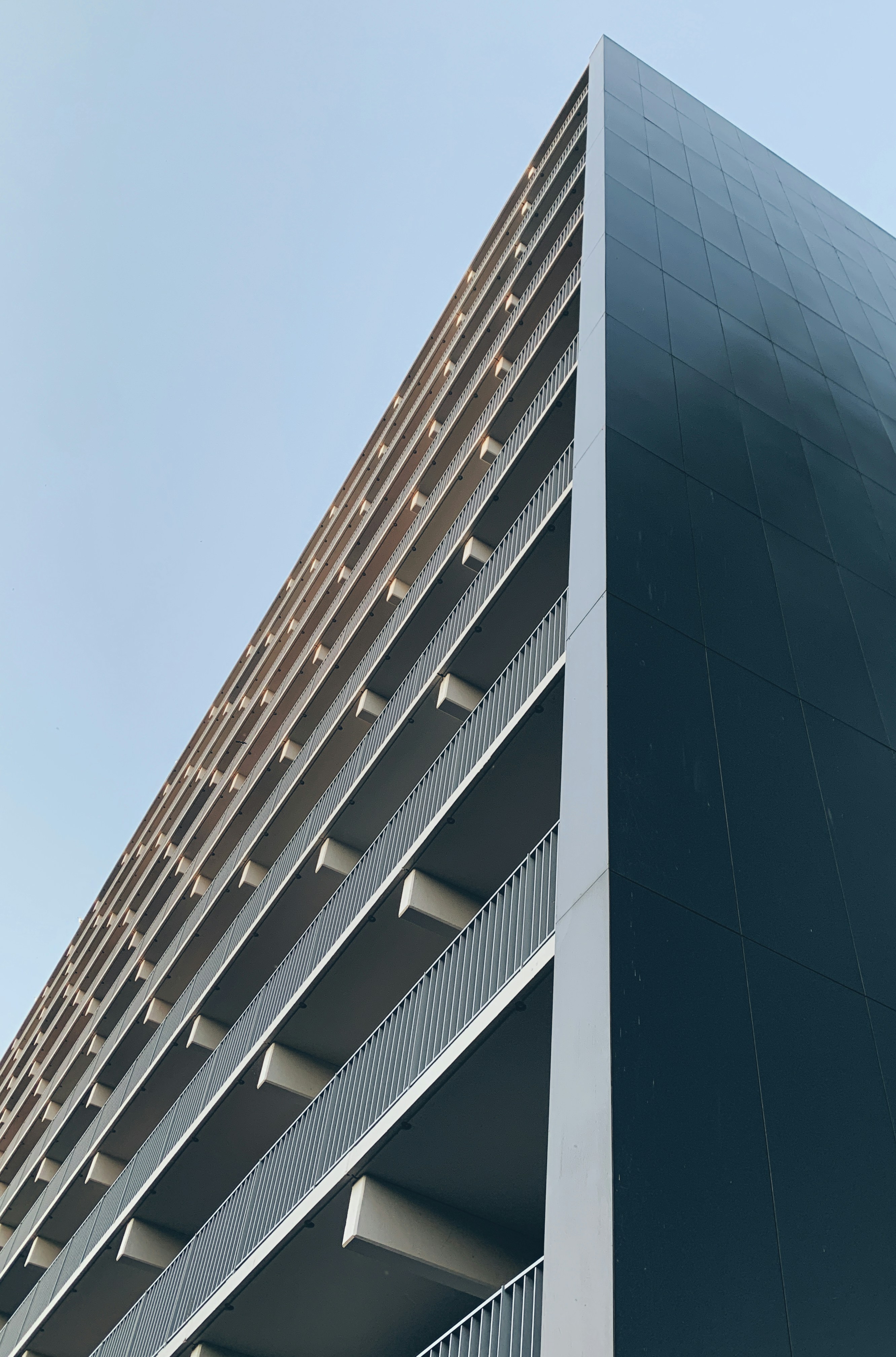 a tall building with balconies on top of it