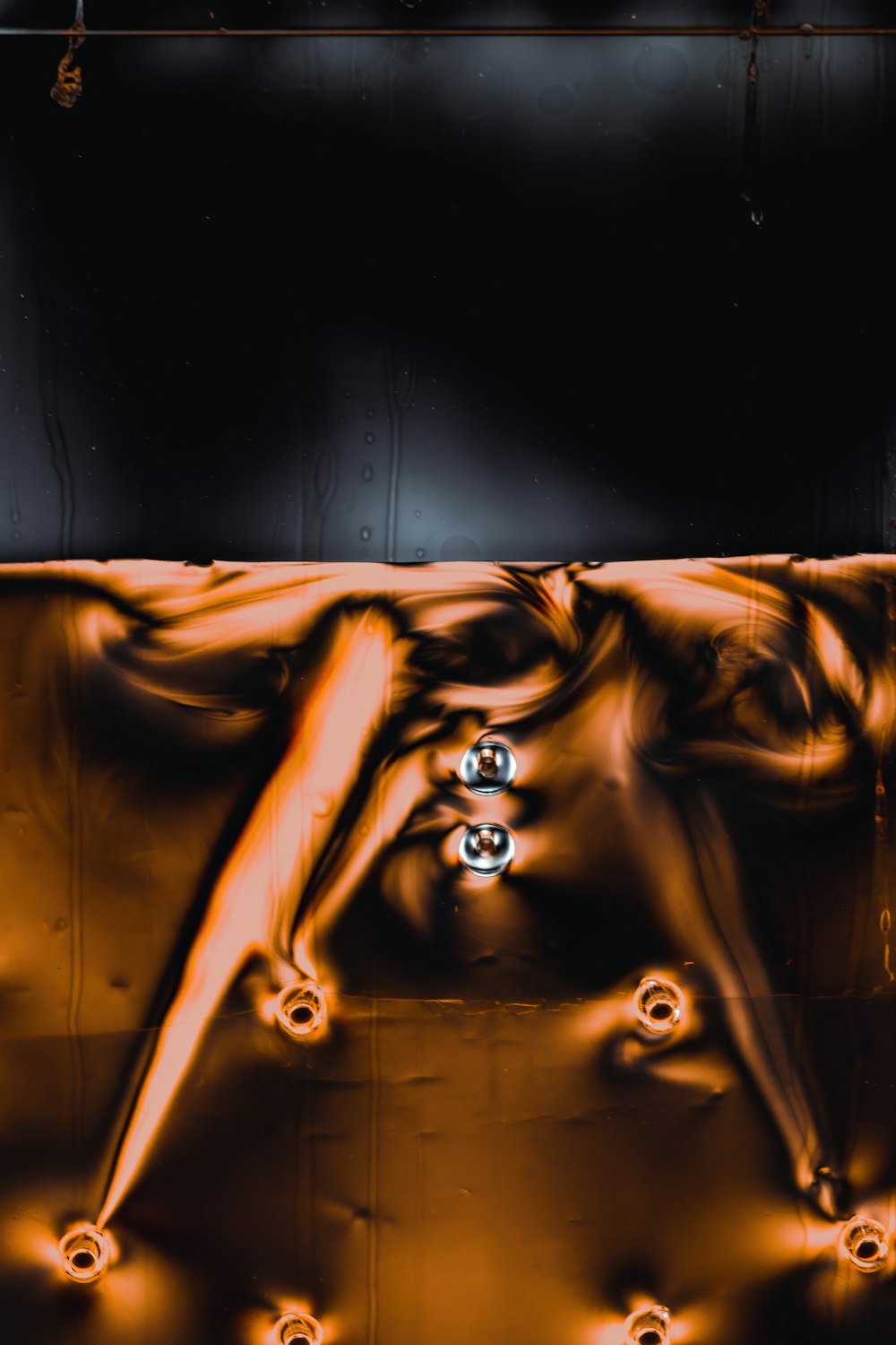 an abstract image of a woman's body in orange and black