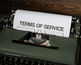 a close up of a typewriter with a paper on it