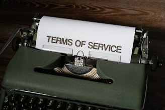 a close up of a typewriter with a paper on it