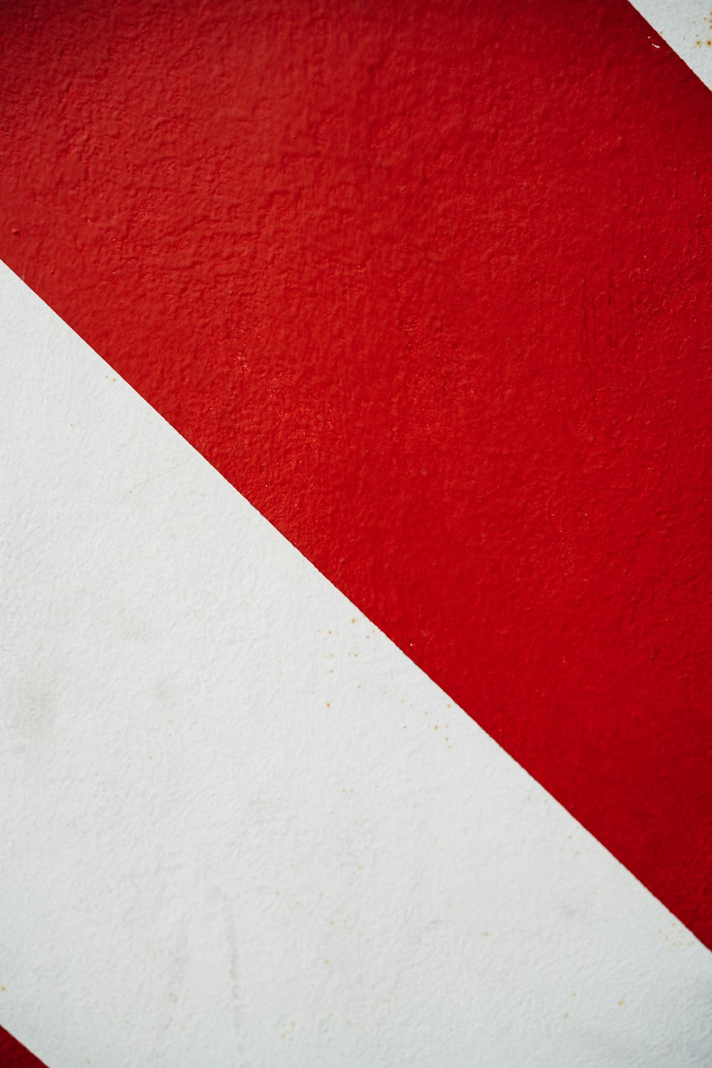 a close up of a red and white striped wall