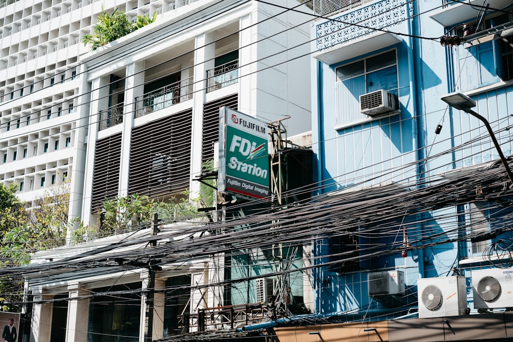 a building with lots of wires and a sign on it