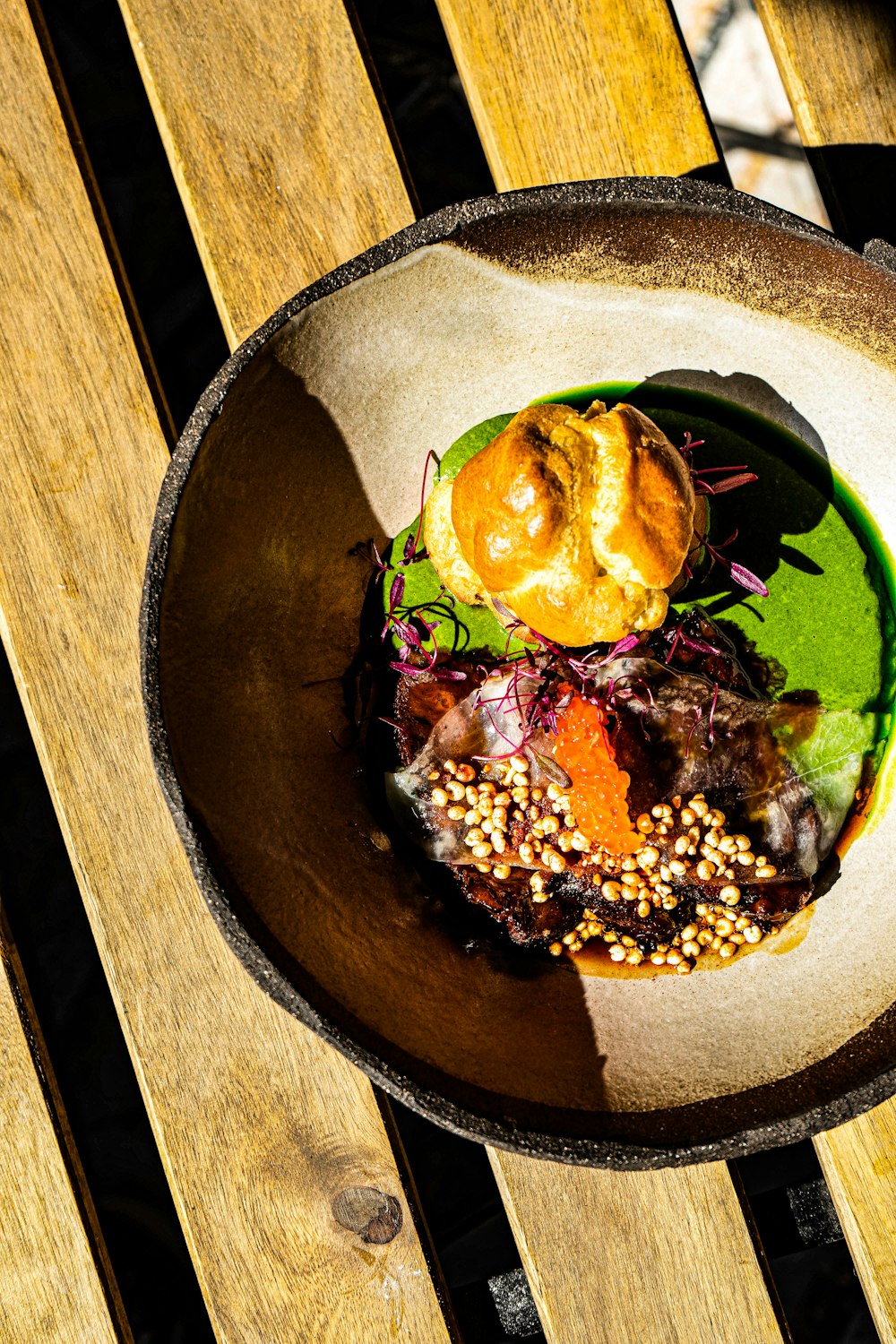 a plate of food on a wooden table