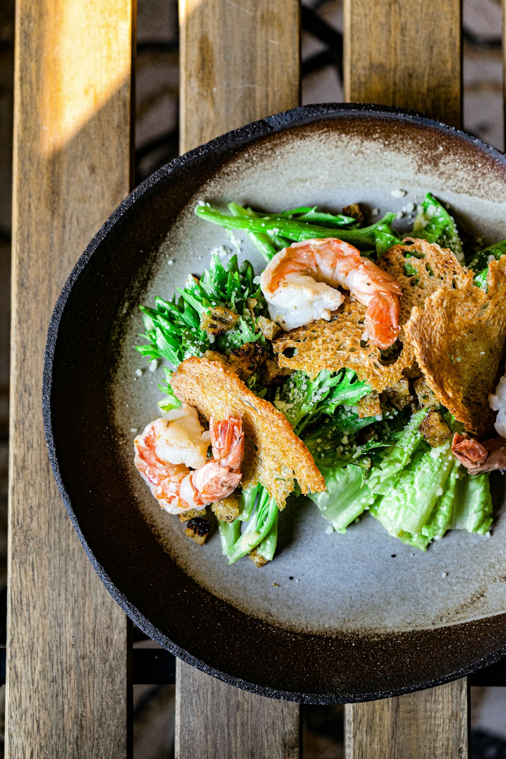 a plate of food on a wooden table