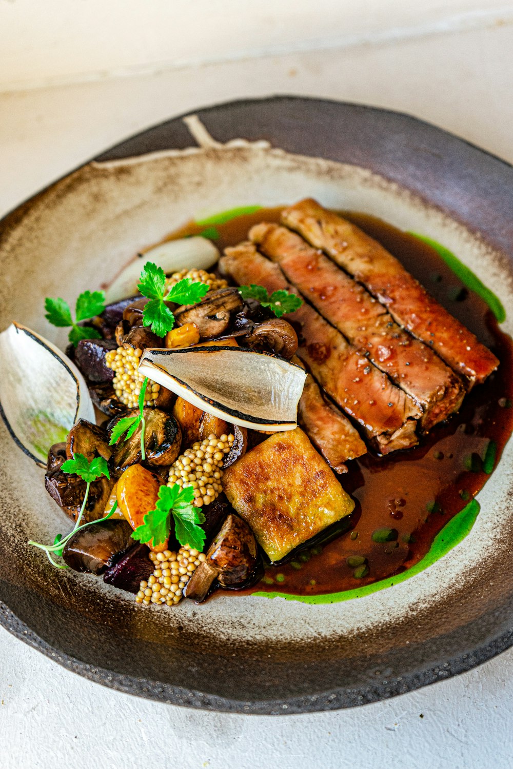 a plate of food with meat and vegetables