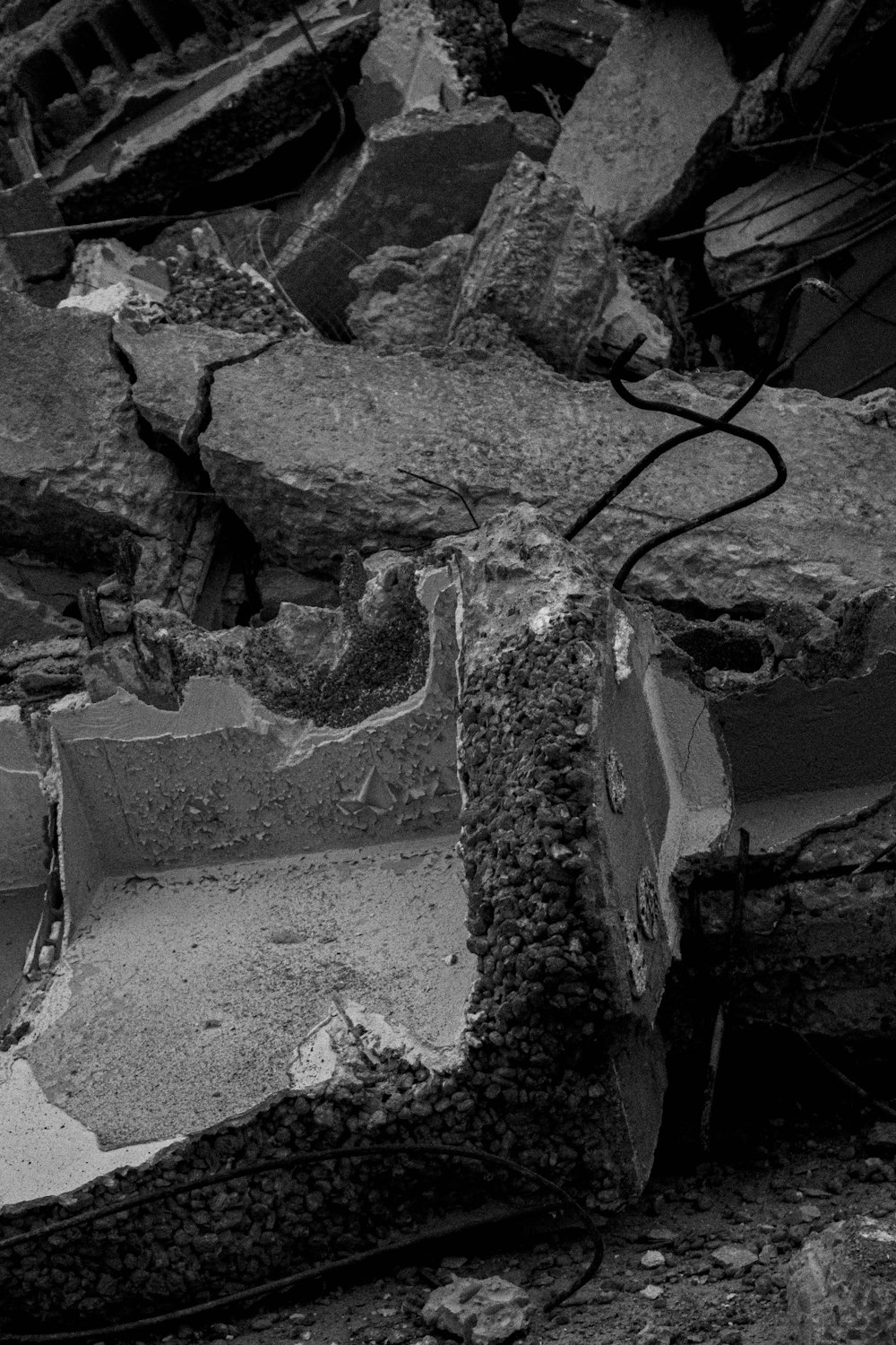 a black and white photo of a pile of rubble