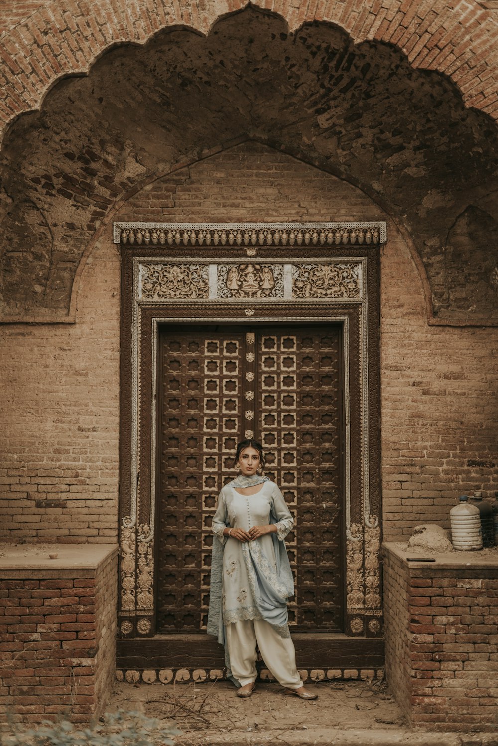 a woman standing in front of a doorway