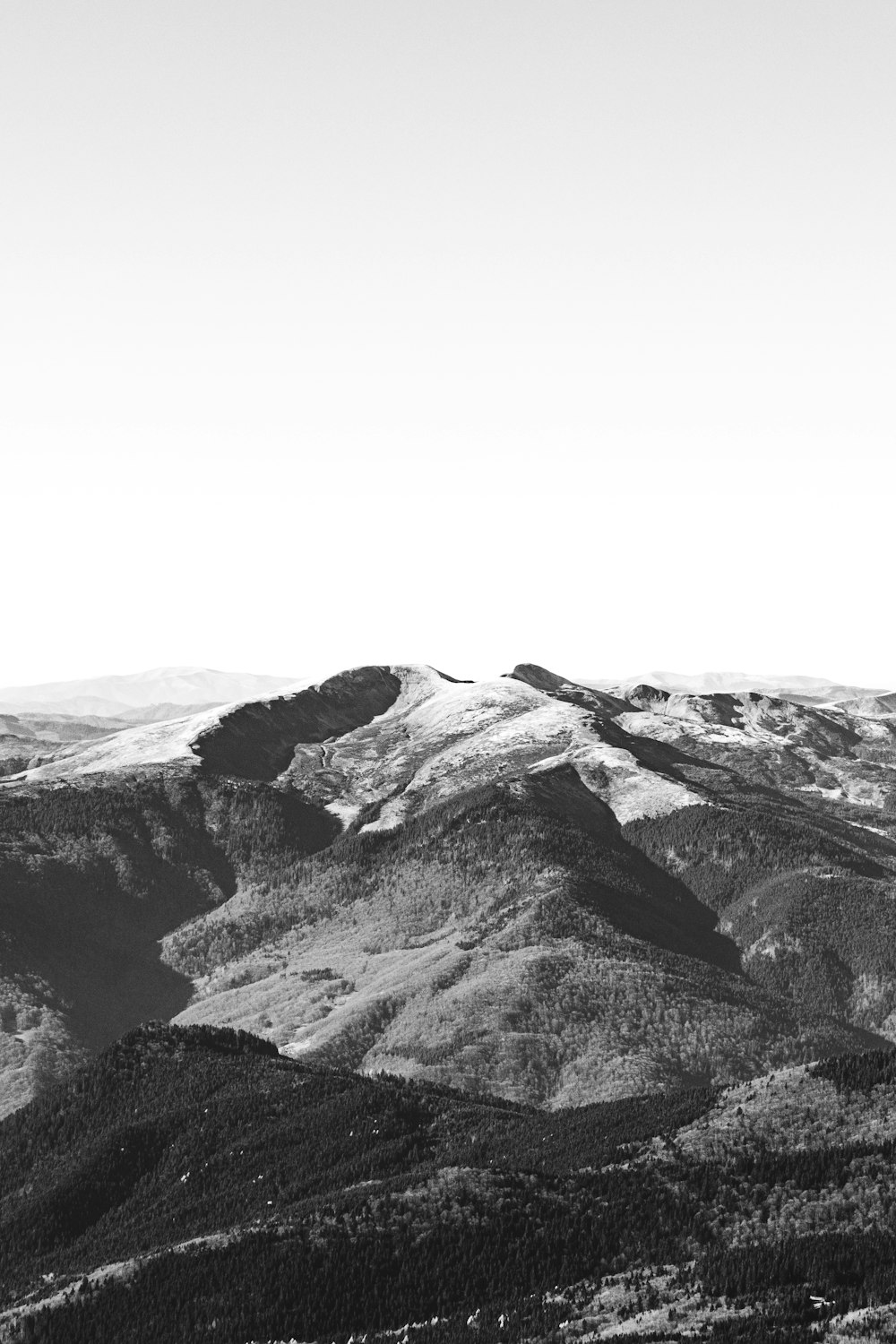 a black and white photo of a mountain range