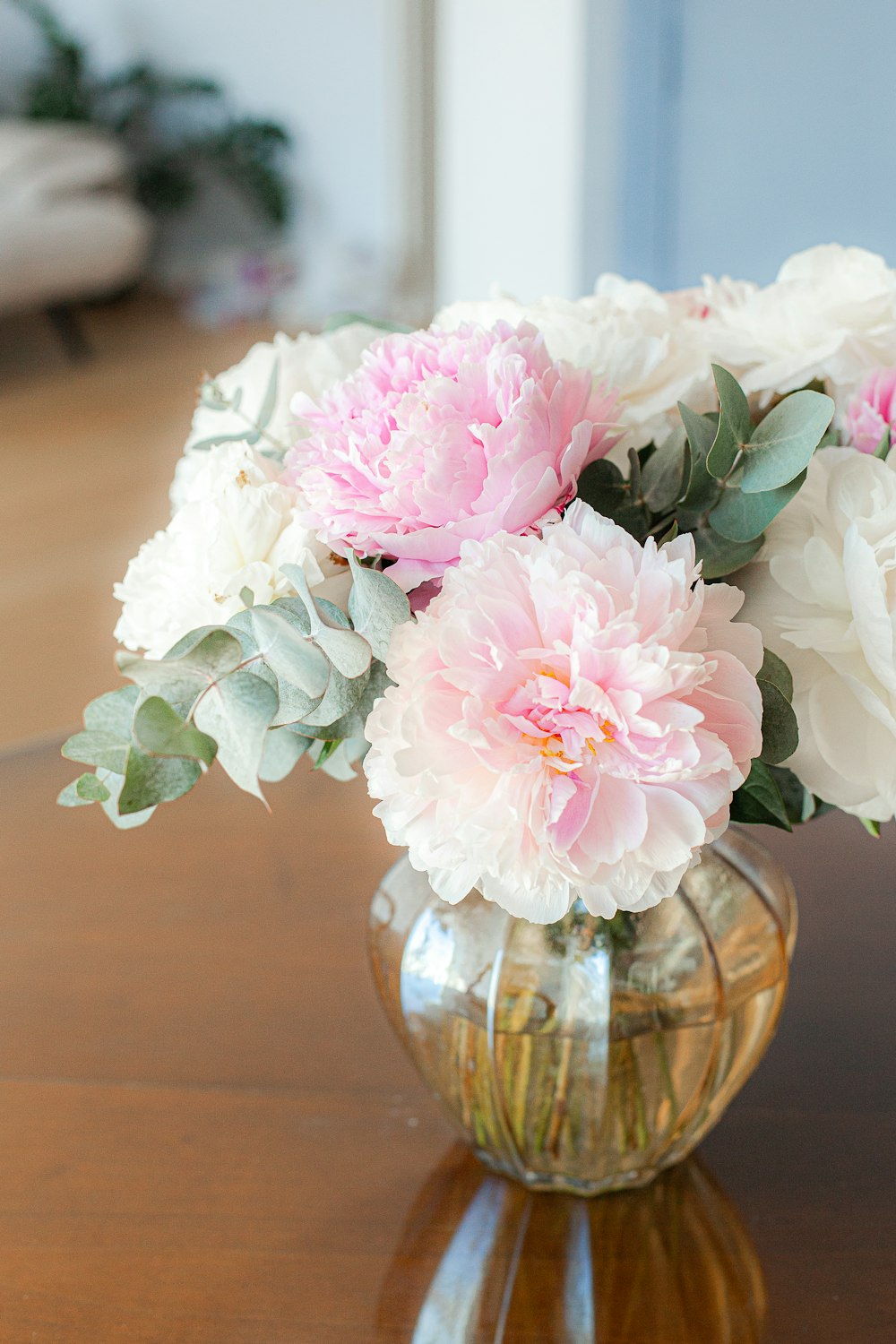 a bouquet of flowers in a vase on a table