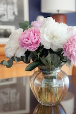 a bouquet of flowers in a vase on a table
