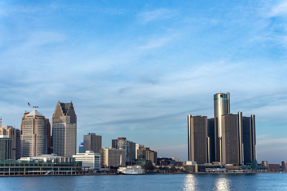 a large body of water with a city in the background