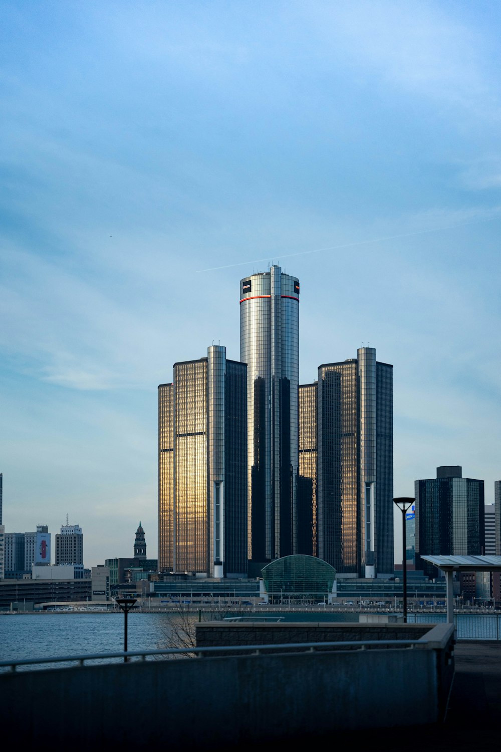 a very tall building sitting next to a body of water