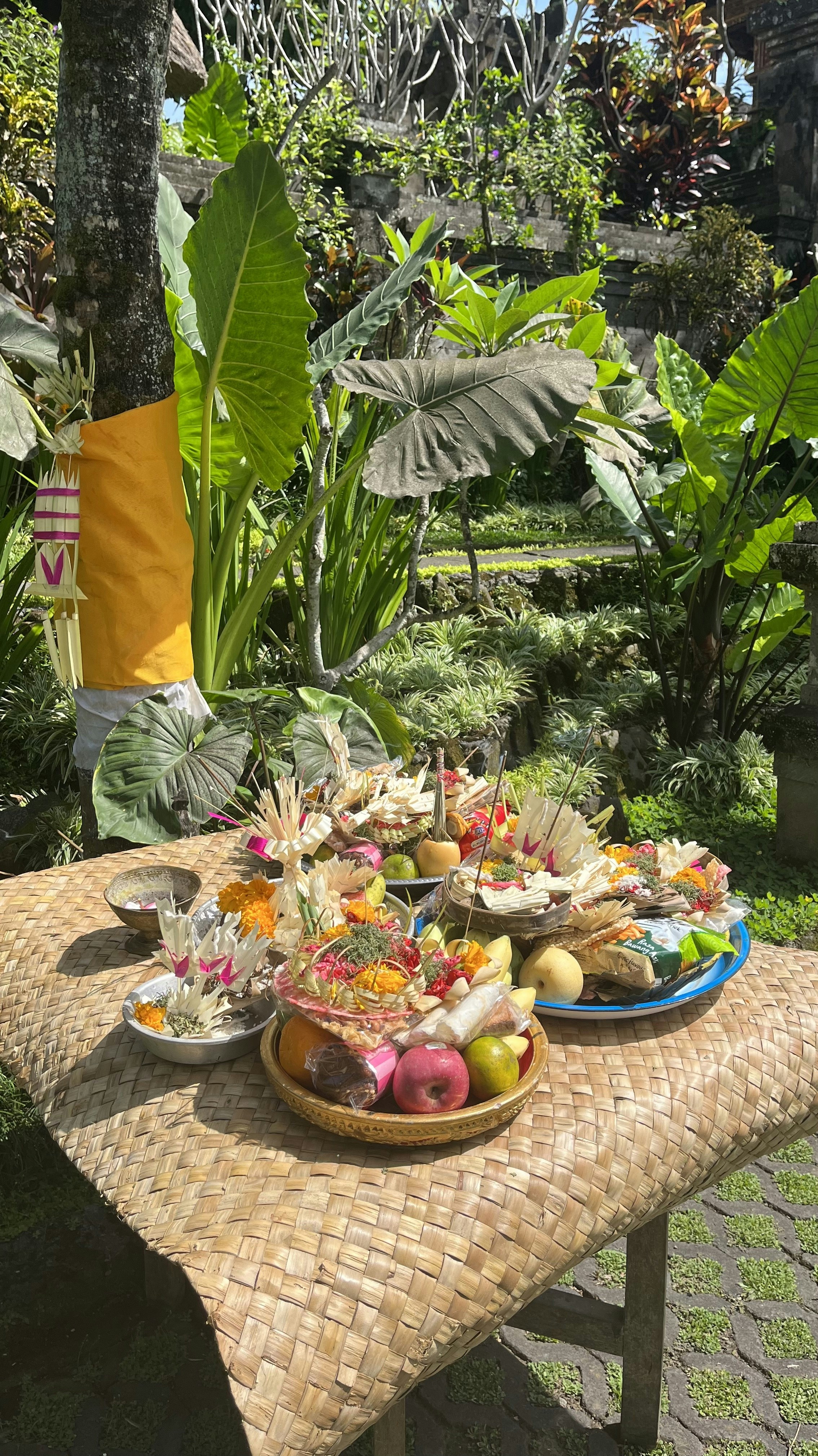 a table topped with plates of food on top of a wooden table